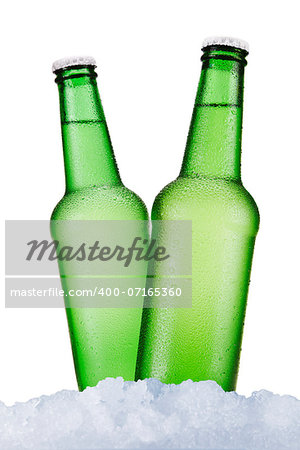 Three green beer bottles sitting on ice over a white background.