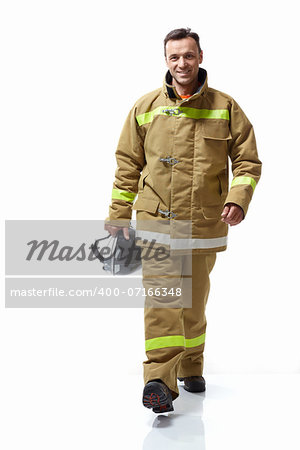 Smiling firefighter in uniform on a white background