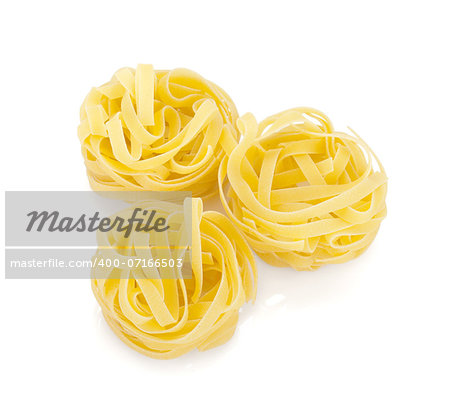 Fettuccine nest pasta. Isolated on white background