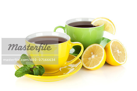 Two colorful cups of tea with lemon and mint. Isolated on white background