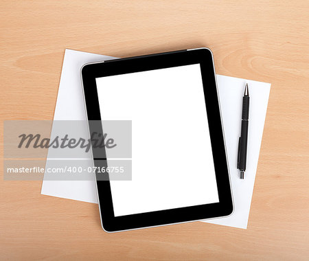 Tablet with blank screen and pen over white papers. View from above
