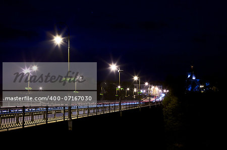 bridge over Smotrych River in Kamianets-Podilskyi, Ukraine, at night