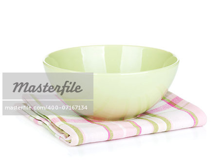 Salad bowl over kitchen towel. Isolated on white background