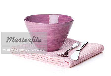 Salad bowl and silverware over kitchen towel. Isolated on white background