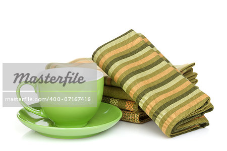 Coffee cup and kitchen towels. Isolated on white background