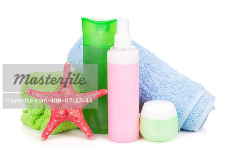 Towels and beach cosmetics. Isolated on white background