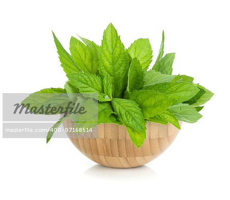 Wood bowl with fresh mint. Isolated on white backround