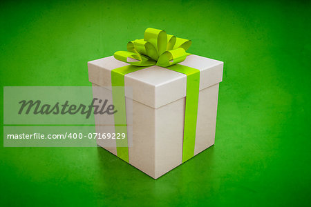 An image of a nice gift box on a green background