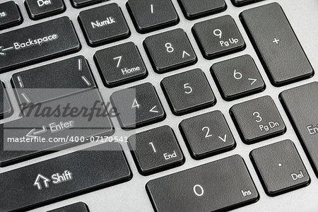 Closeup of computer keyboard - black number keys on notebook laptop