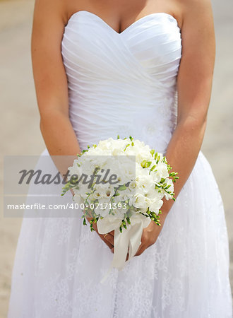 Bride holding beautiful wedding  bouquet.