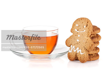 Glass cup of black tea with homemade cookies and gingerbread man. Isolated on white background