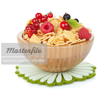 Fresh corn flakes with berries in bowl. Isolated on white background