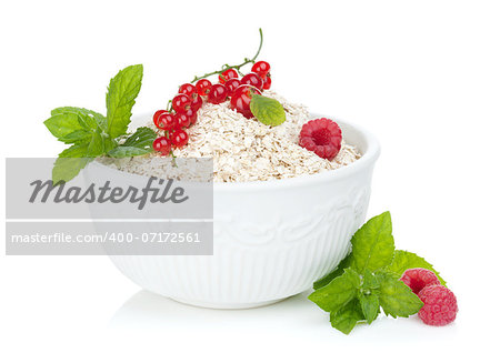 Fresh oat flakes with berries. Isolated on white background