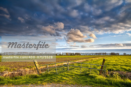 fence on beautiful Dutch farmland before sunset, Groningen, Netherlands