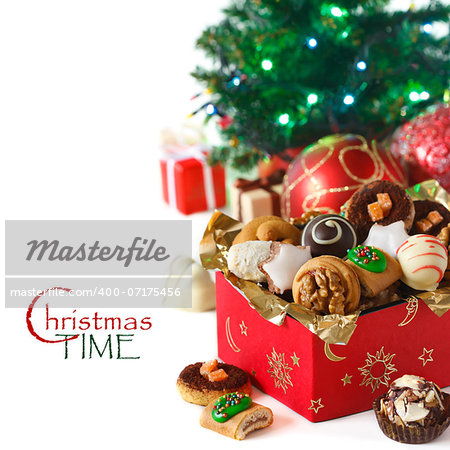 Sweet Christmas cookies in a present box on a white background.