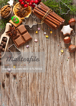 Christmas decoration with cookies and spices on an old wooden background.