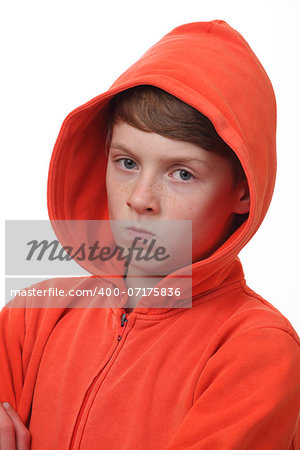 Portrait of a frustrated young boy on white background