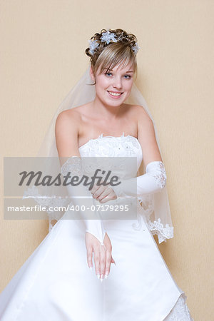 beautiful bride puts on a long white glove
