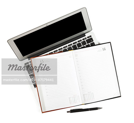 Blank notepad over laptop. Isolated on white background