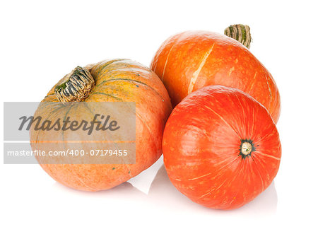 Three ripe small pumpkins. Isolated on white background