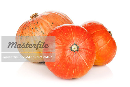Three ripe small pumpkins. Isolated on white background