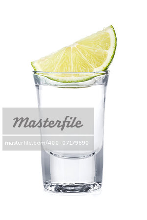 Shot of vodka and lime slice. Isolated on white background