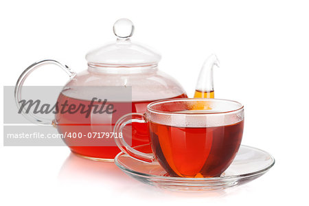 Glass cup and teapot of black tea. Isolated on white background