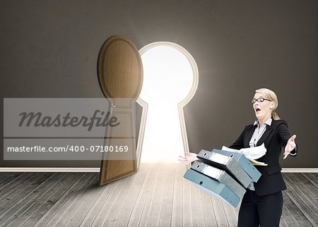 Composite image of businesswoman dropping many folders in room with door shaped as keyhole