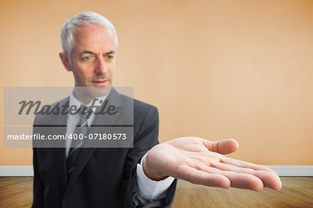 Composite image of concentrated businessman with palm up standing in bright 3d room