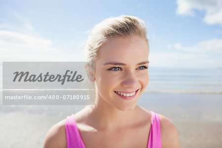Close up of a smiling healthy woman on beach