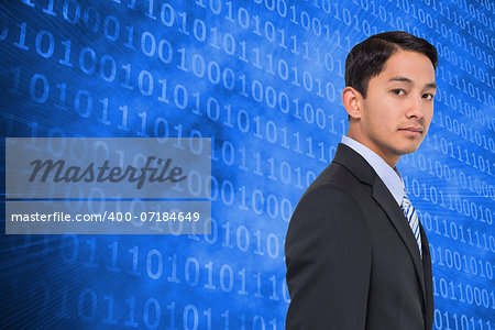 Composite image of serious asian businessman