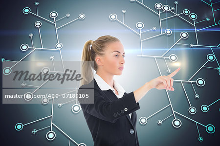 Composite image of blonde businesswoman pointing somewhere