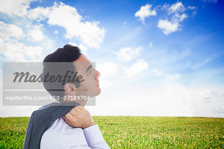 Composite image of unsmiling businessman standing