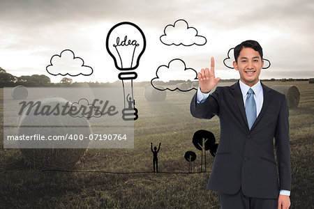 Composite image of smiling asian businessman pointing