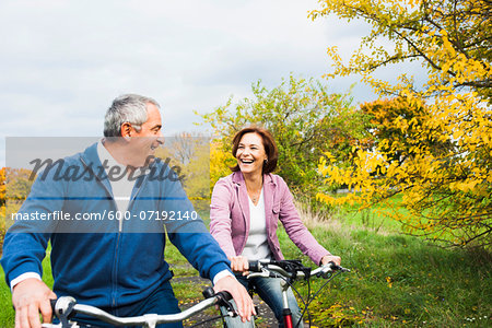 Couple Riding Bicycles in Autumn, Mannheim, Baden-Wurttemberg, Germany