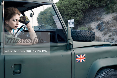 Woman Soldier in Military Vehicle Woman Soldier in Military Vehicle