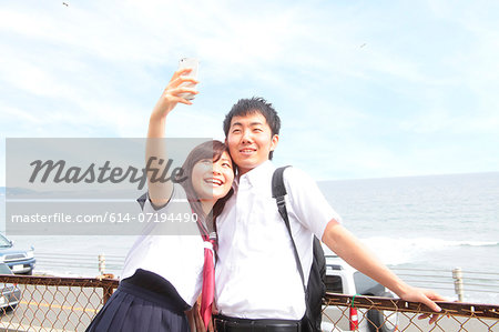 Young couple taking self portrait photograph