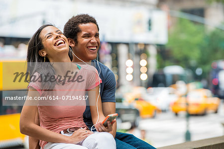 Couple listening to music on mobile phone