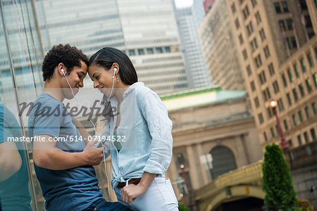 Couple listening to music on mobile phone