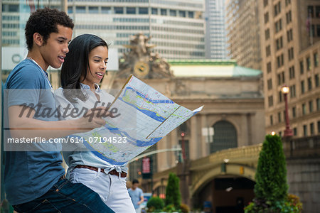 Couple reading road map