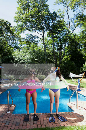 Friends playing by pool