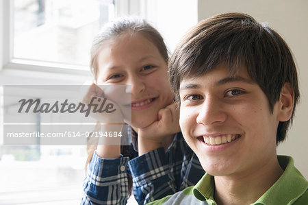 Portrait of brother and sister smiling