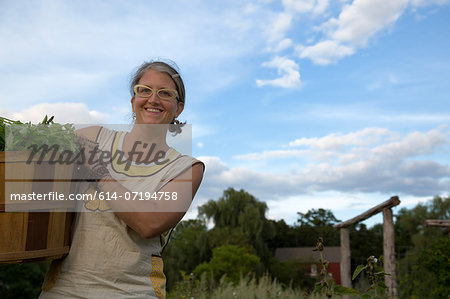 Portrait of woman working on herb farm Portrait of woman working on herb farm