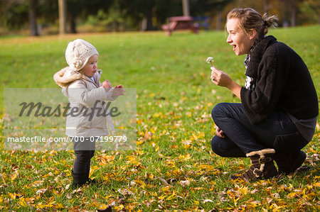 Mother Playing with Baby Daughter Outdoors, Scanlon Creek Conservation Area, Ontario, Canada