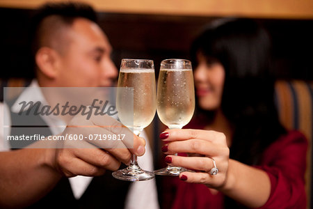 Close-up of couple toasting with champagne glasses, Ontario, Canada Close-up of couple toasting with champagne glasses, Ontario, Canada