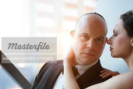 Close-up of bride and groom embracing, Ontario, Canada Close-up of bride and groom embracing, Ontario, Canada