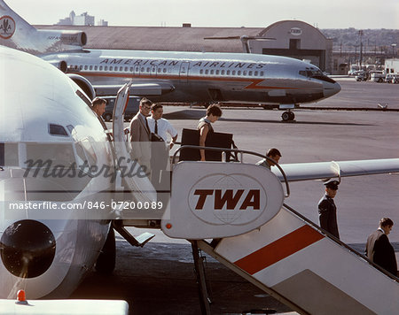 1960s PASSENGERS DEPLANING BOEING 727 TWA JET NEWARK AIRPORT NEW JERSEY 1960s PASSENGERS DEPLANING BOEING 727 TWA JET NEWARK AIRPORT NEW JERSEY