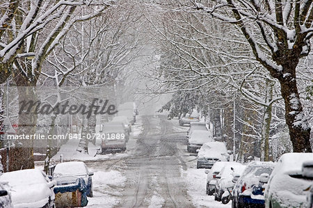 Cars parked in a snow-covered Hampstead street, North London, England, United Kingdom Cars parked in a snow-covered Hampstead street, North London, England, United Kingdom