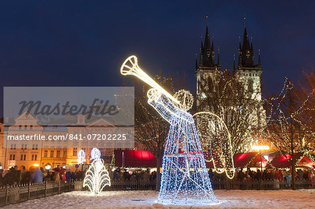 Christmas decorations at Christmas Market and Gothic Tyn Church, Old Town Square, Prague, Czech Republic, Europe