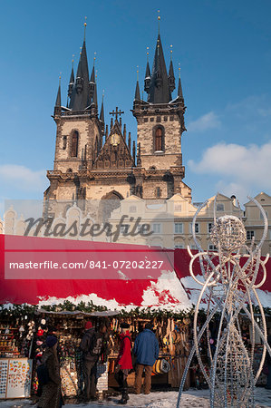 Snow-covered Christmas Market and Tyn Church, Old Town Square, Prague, Czech Republic, Europe